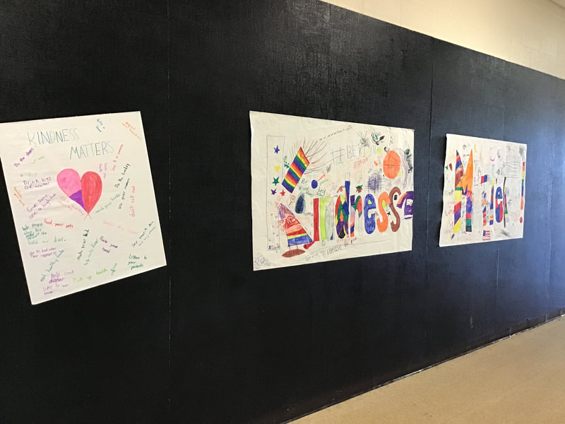 Posters displayed in hallway that say "Kindness Matters." 